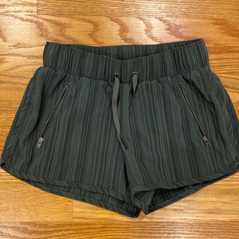 Olive green athleta shorts with pockets